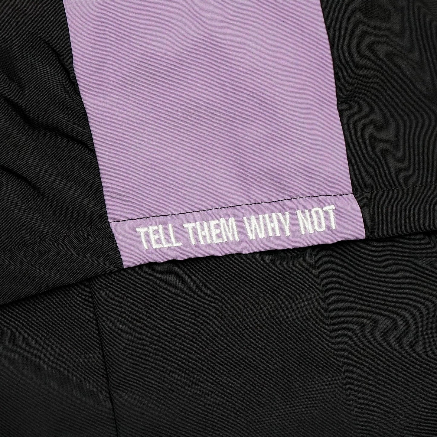 Black nylon jacket Whynot Series hood embroidery detail - tell them why not