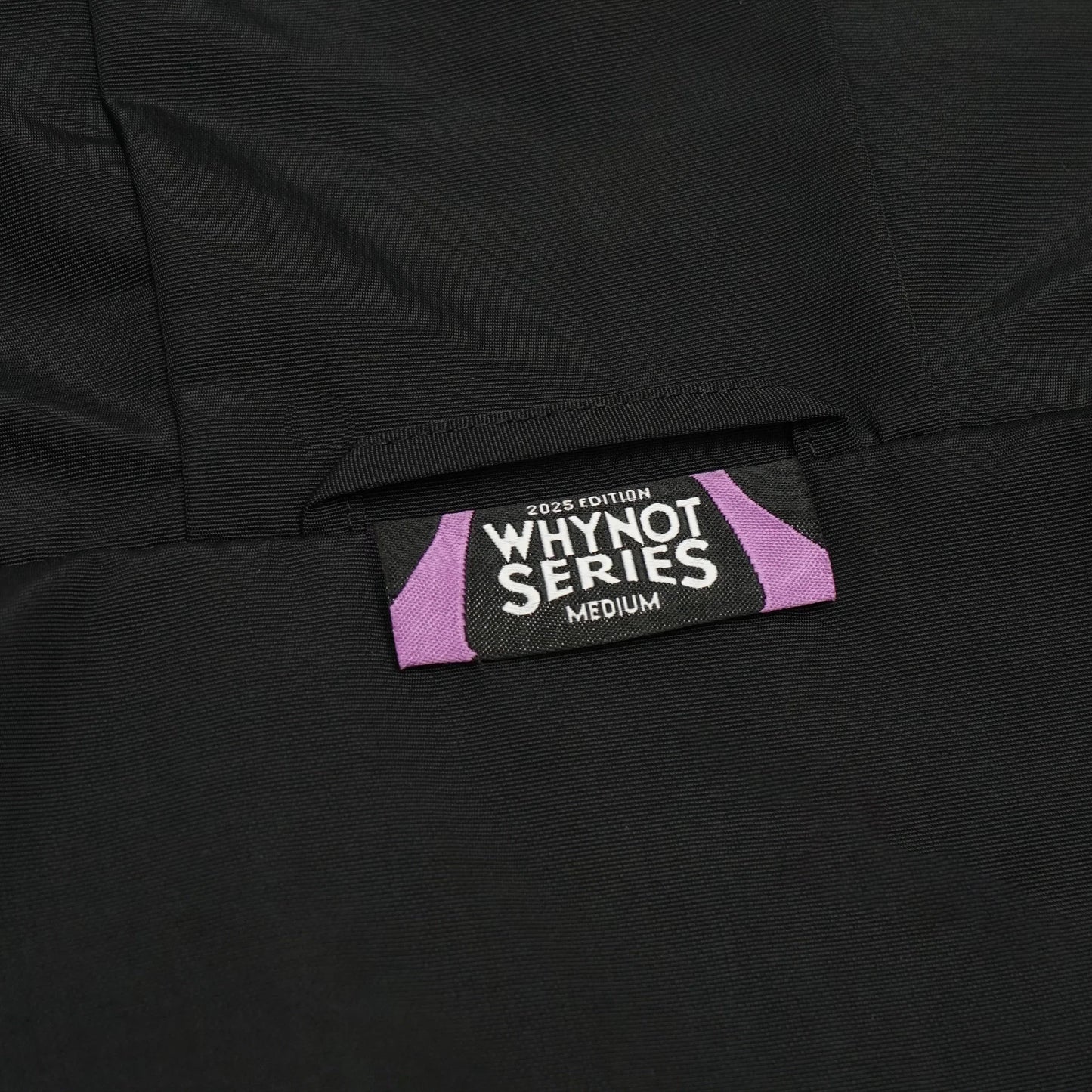 Black nylon jacket Whynot Series label detail - tell them why not