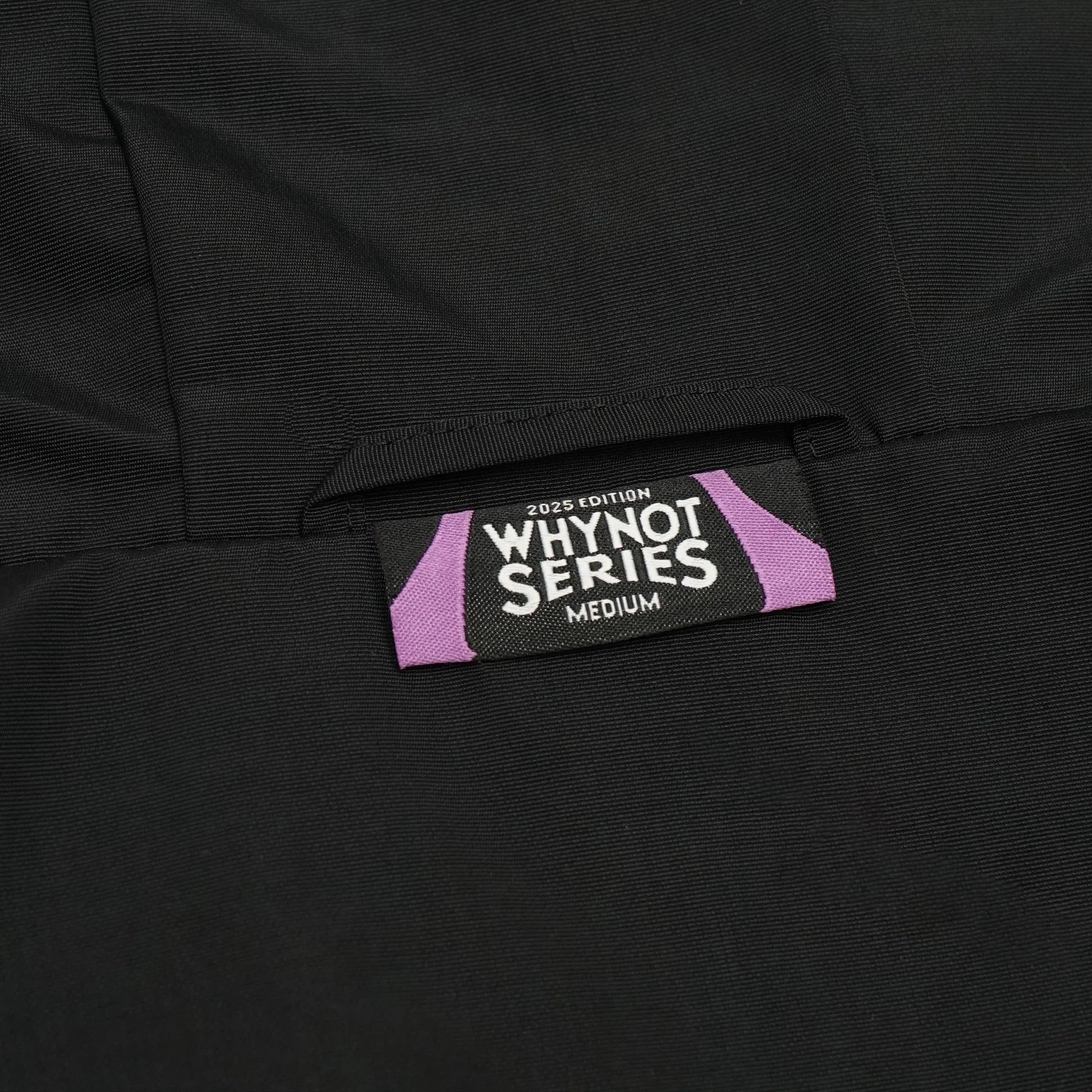Black nylon jacket Whynot Series label detail - tell them why not