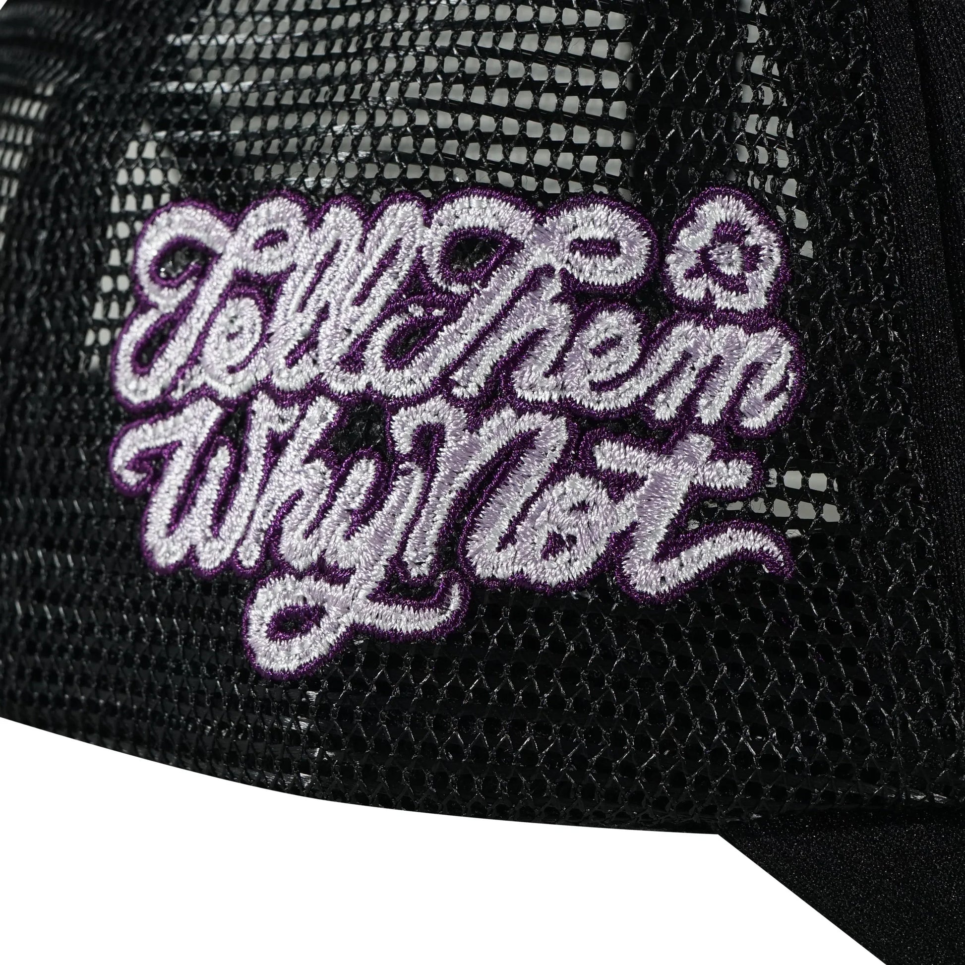 Embroidered typography right side detail on black trucker cap