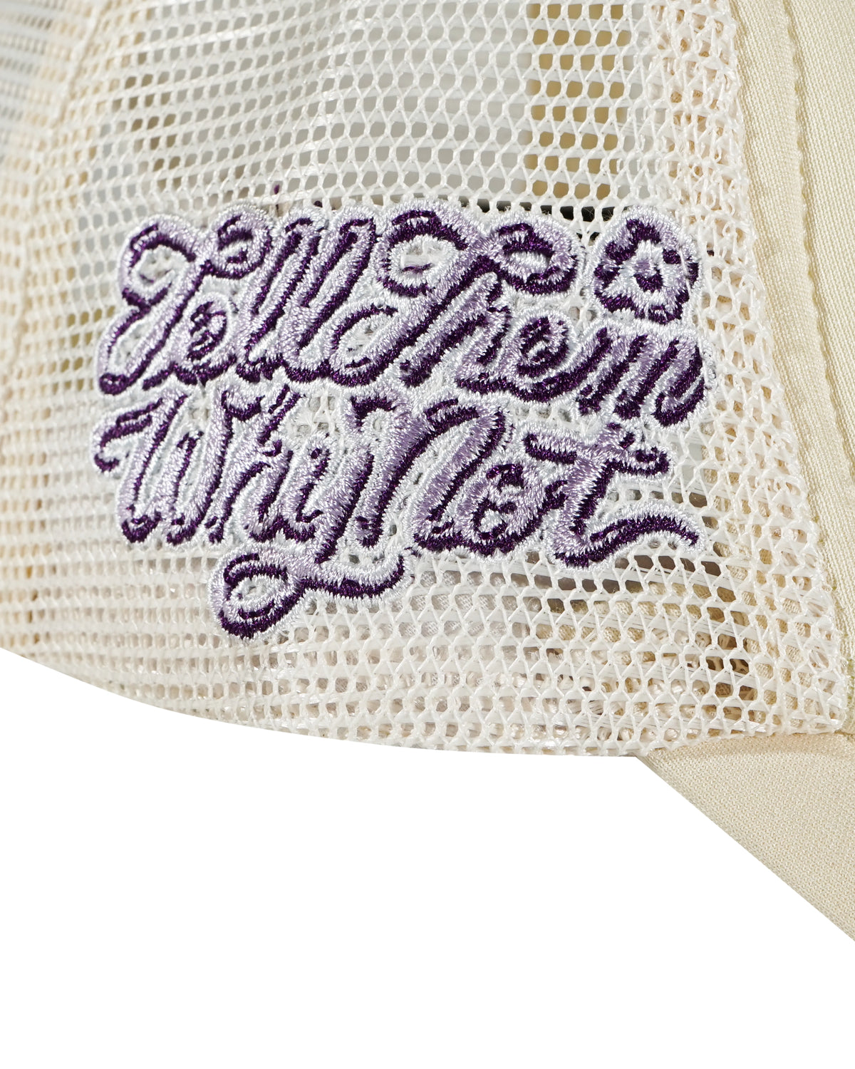 Embroidered stickman typography left side detail on cream trucker cap - tell them why not