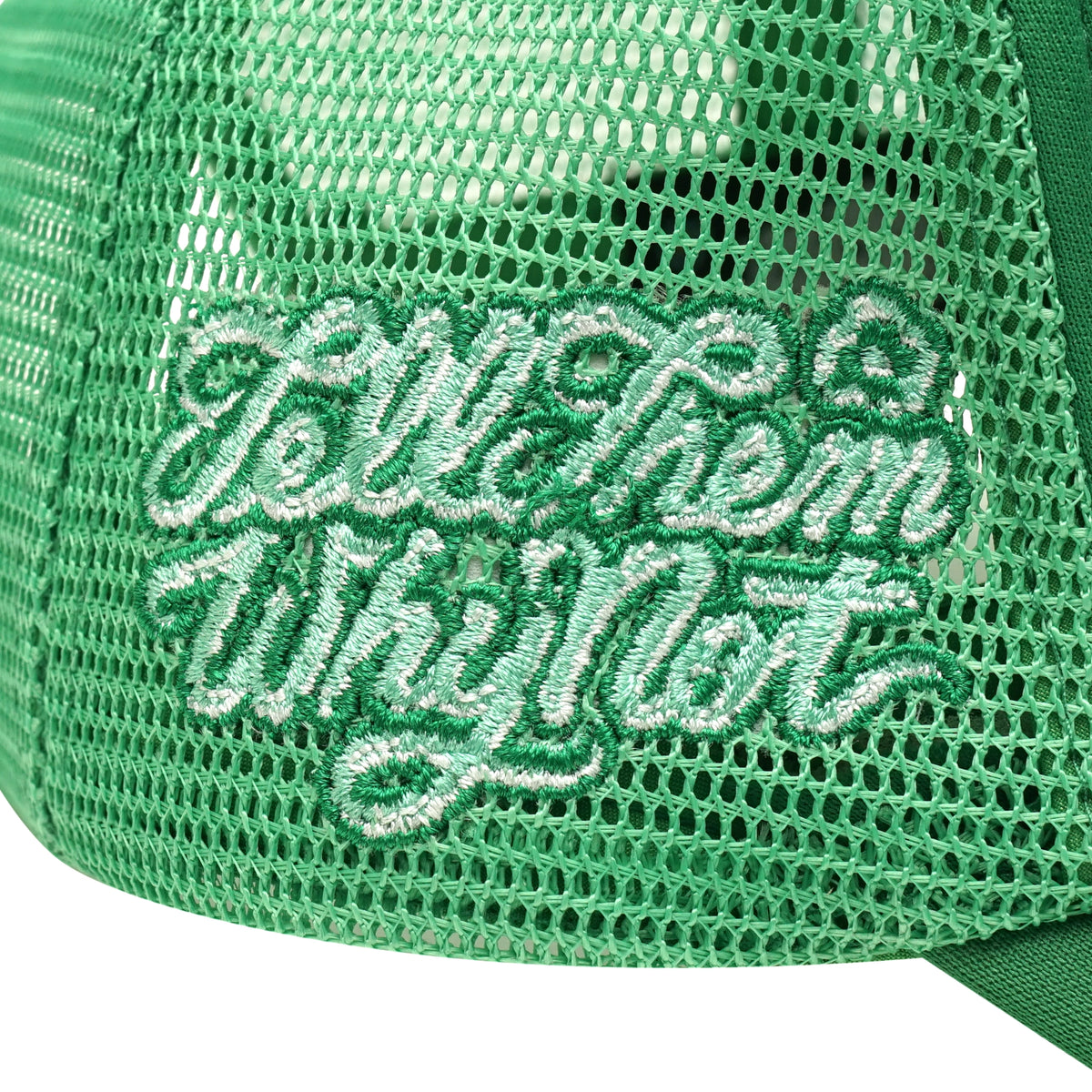 Embroidered typography right side detail on green trucker cap