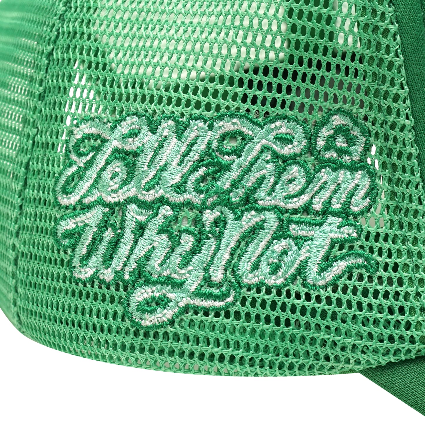 Embroidered typography right side detail on green trucker cap