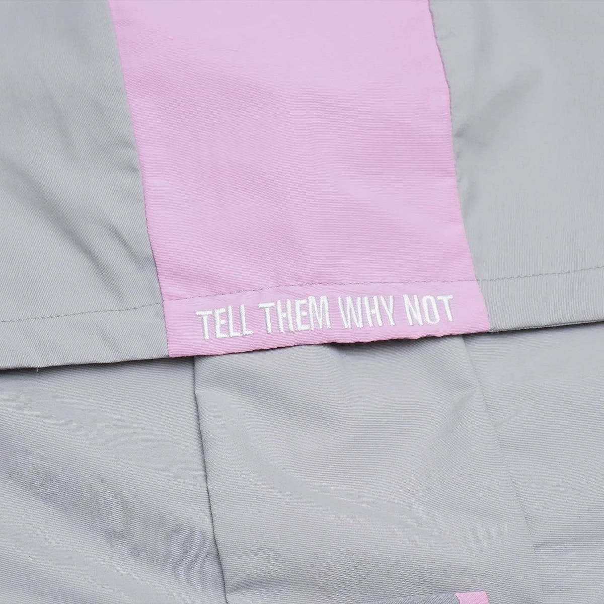 Grey nylon jacket Whynot Series embroidery detail - tell them why not