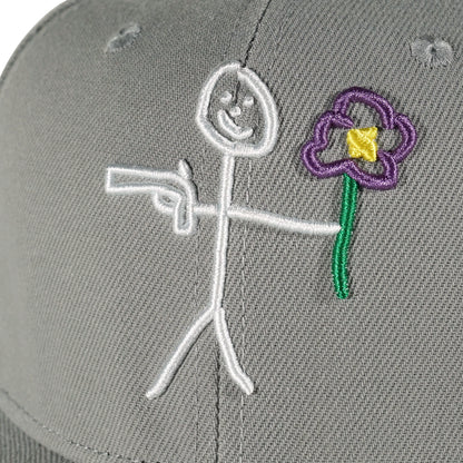 Embroidered stickman logo detail on grey snapback cap - tell them why not