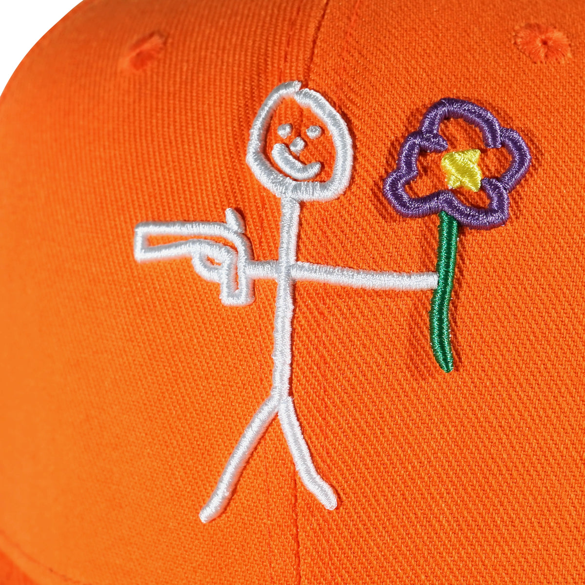 Embroidered stickman logo detail on orange snapback cap - tell them why not