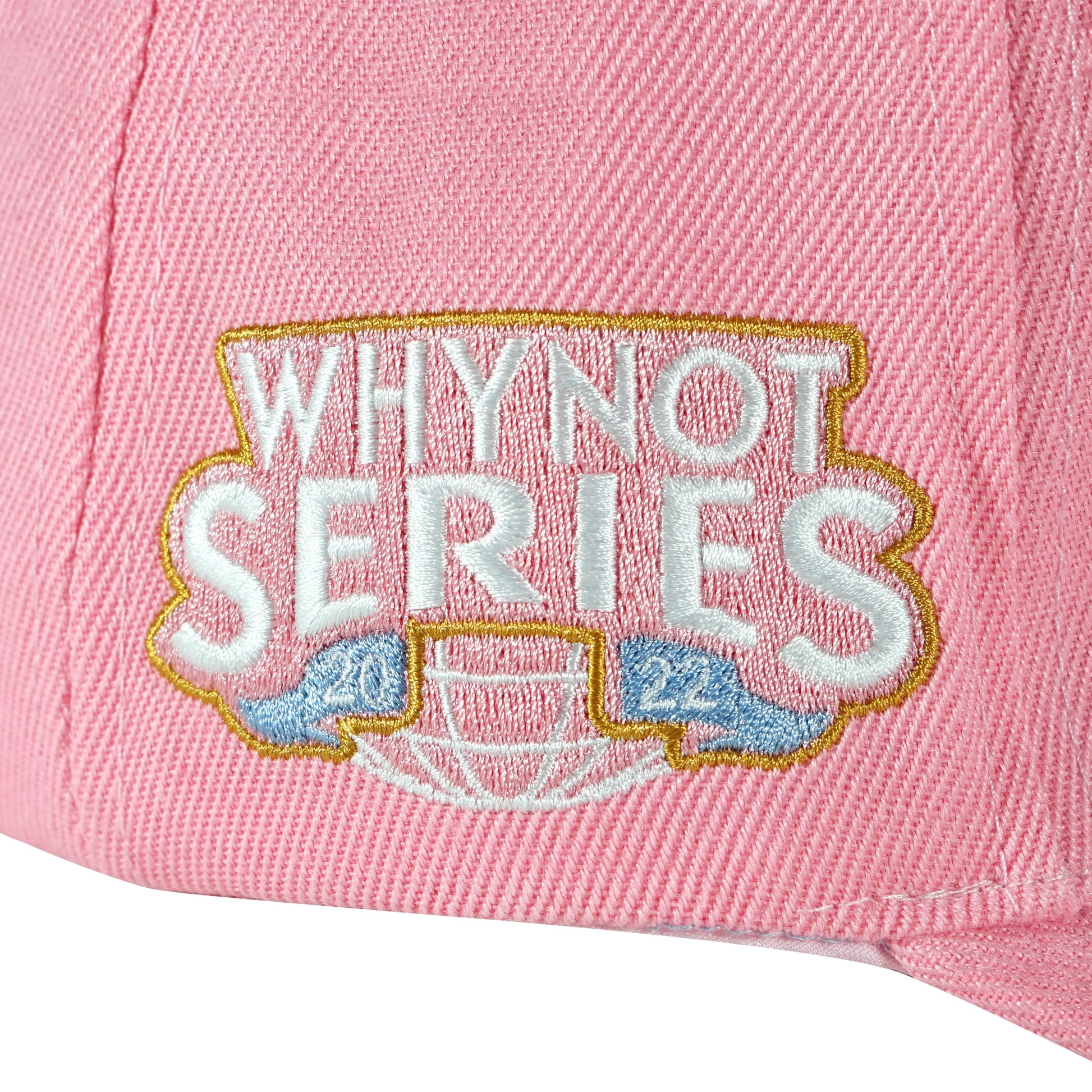 Whynot Series embroidery side detail on pink snapback cap - tell them why not