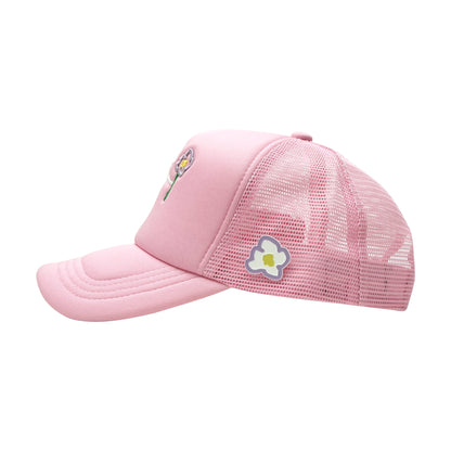 Pink trucker cap left side view with pins flower